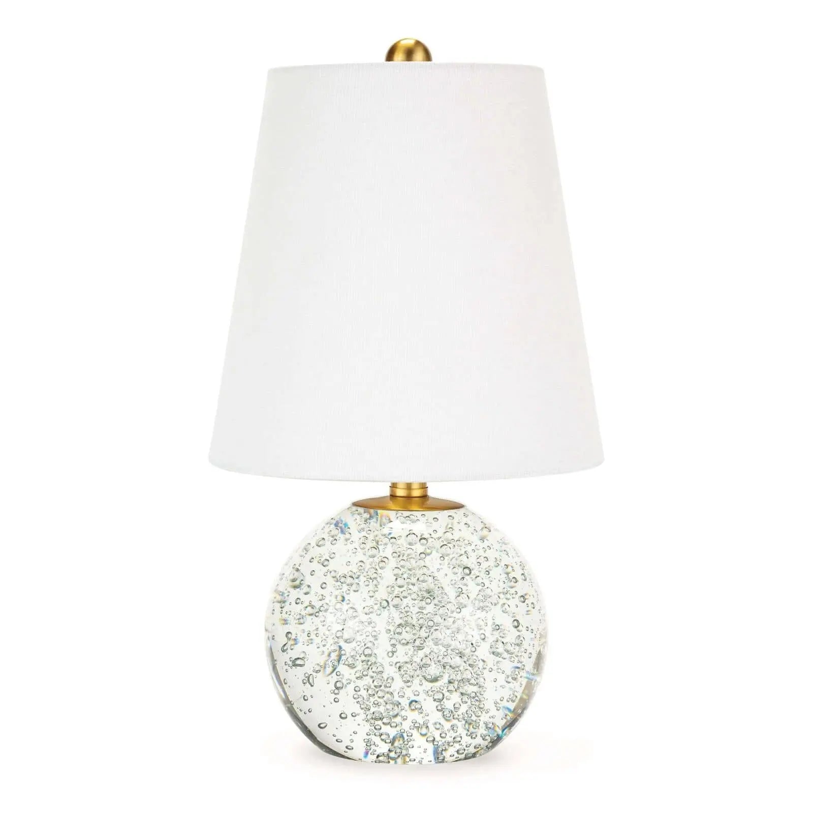 Bulle Crystal Mini Lamp (15" H) with a round clear crystal base containing internal bubbles, gilded neck, and a natural tapered linen shade.