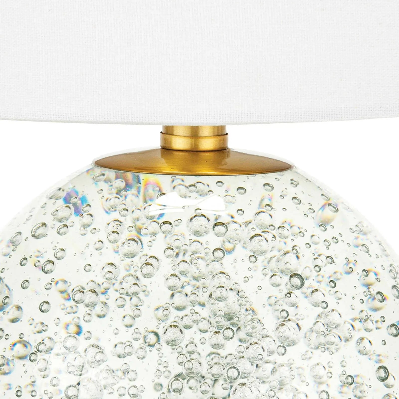 Bulle Crystal Mini Lamp (15" H) with a round clear crystal base containing internal bubbles, gilded neck, and a natural tapered linen shade.