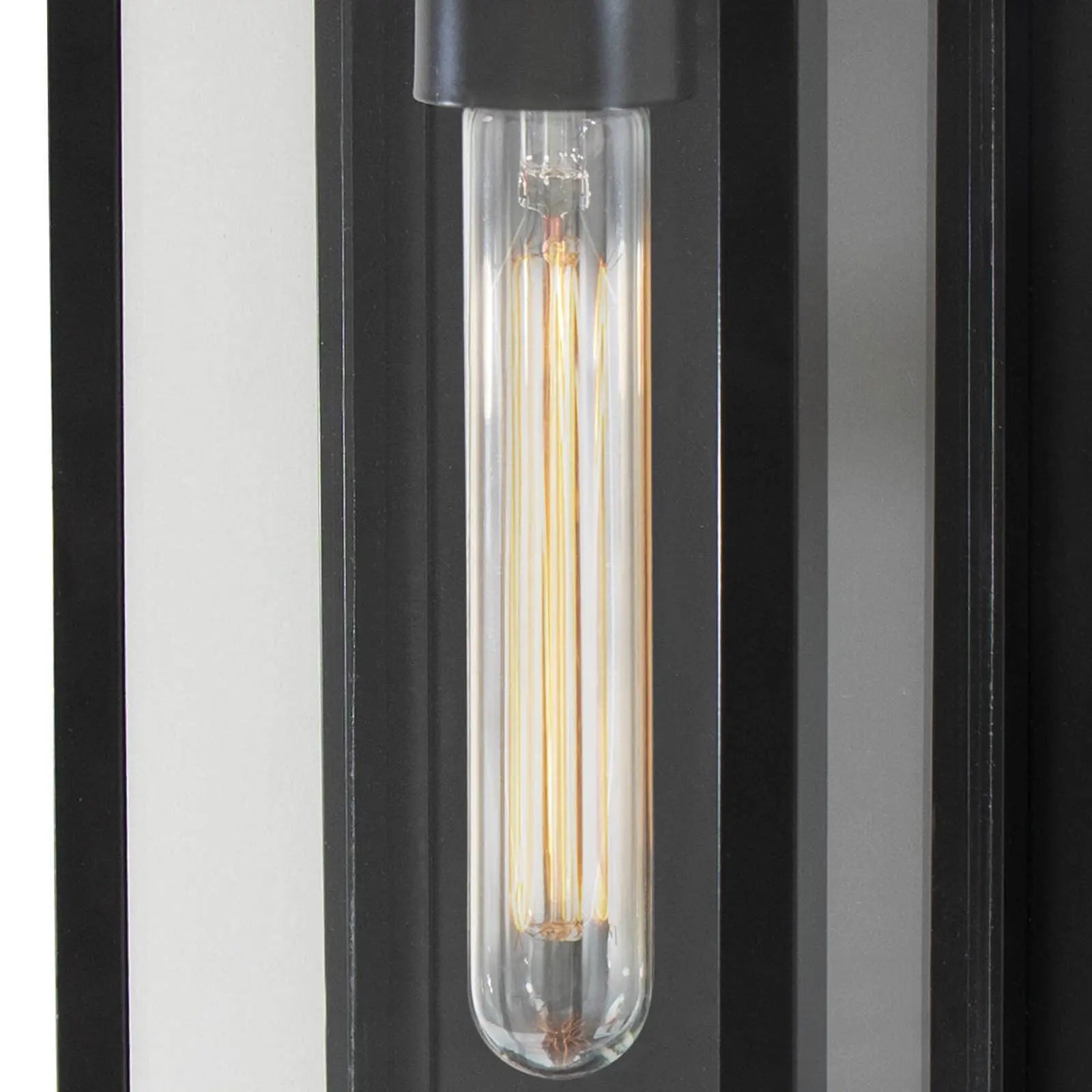 Decorative light bulb in a cylindrical glass holder with a black base on a striped background.