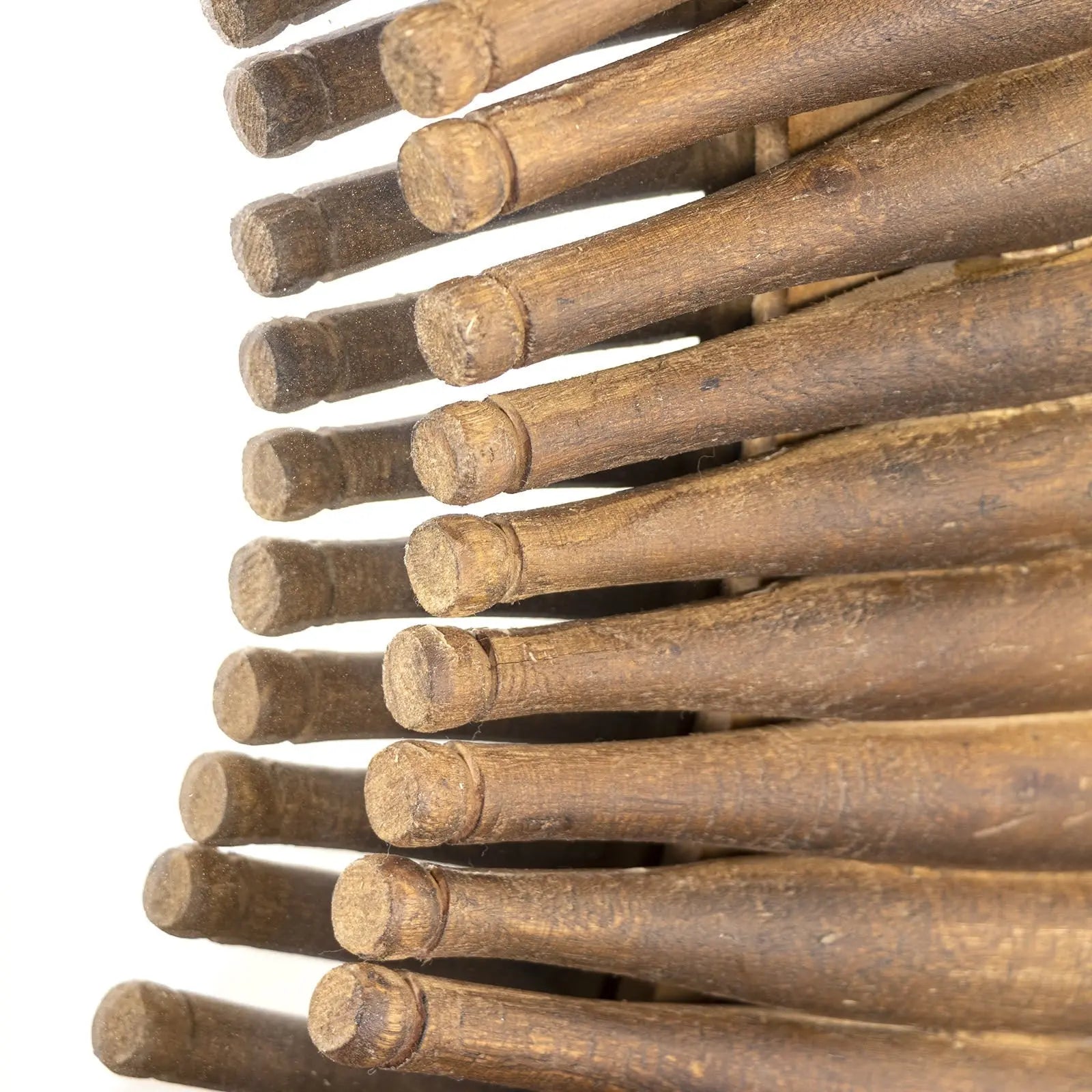 Stack of wooden drumsticks on a white background