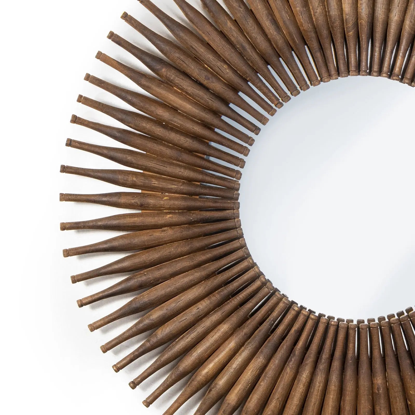 Wooden sunburst mirror on a white background