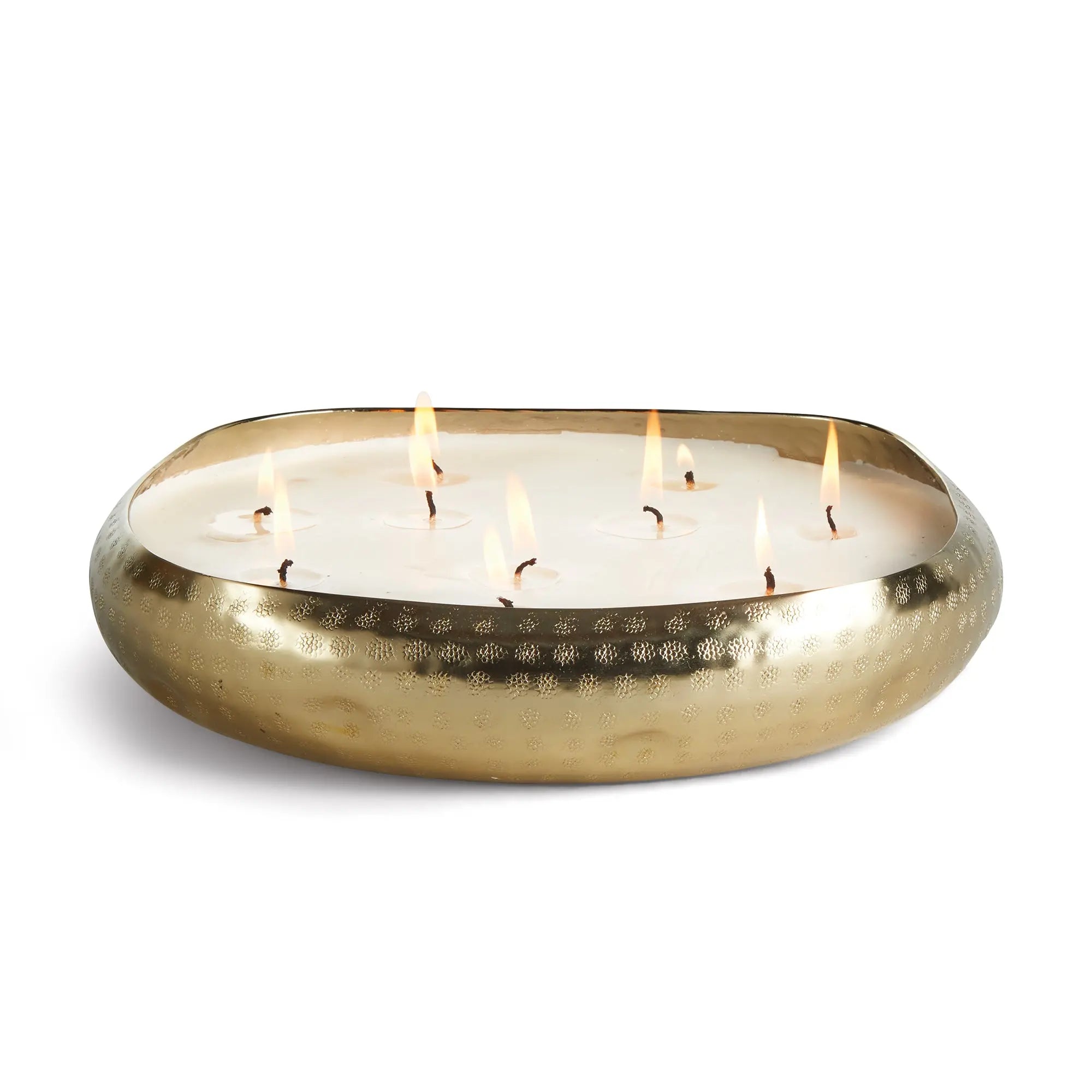 Brass candle holder with lit candles on a white background