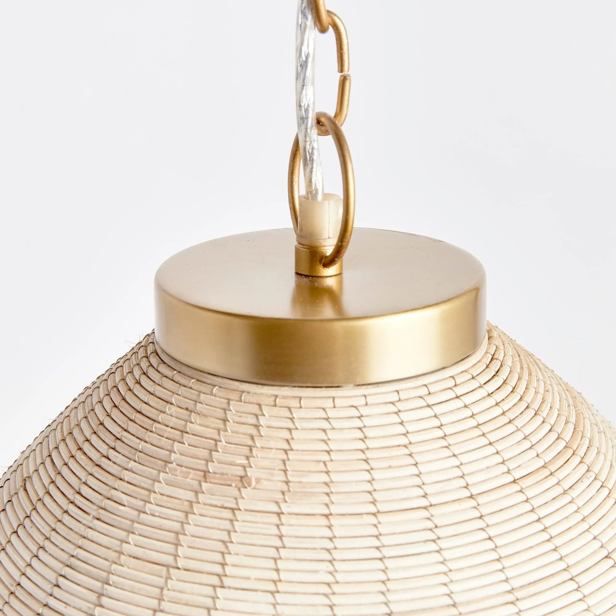 Maye Bell Pendant made of whitewashed rattan with brass accents
