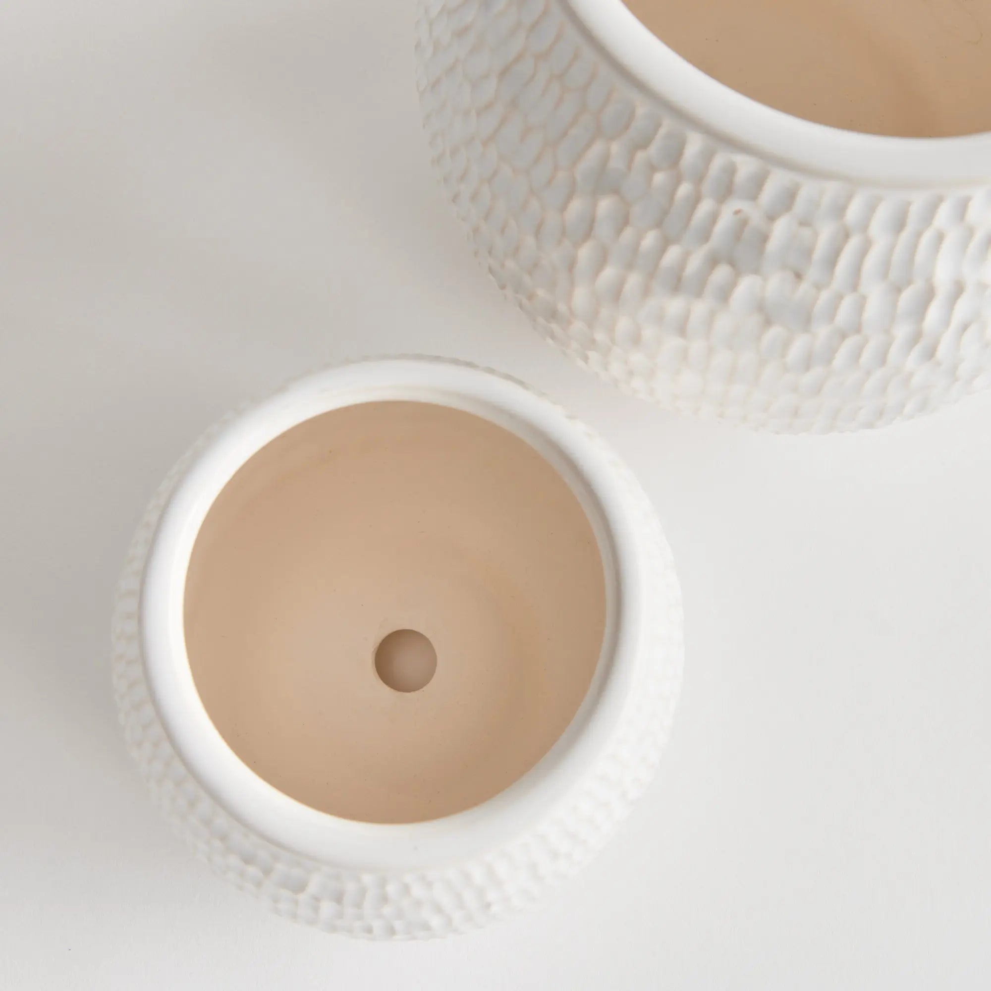 Artisan white pottery planters with drainage for indoor plants