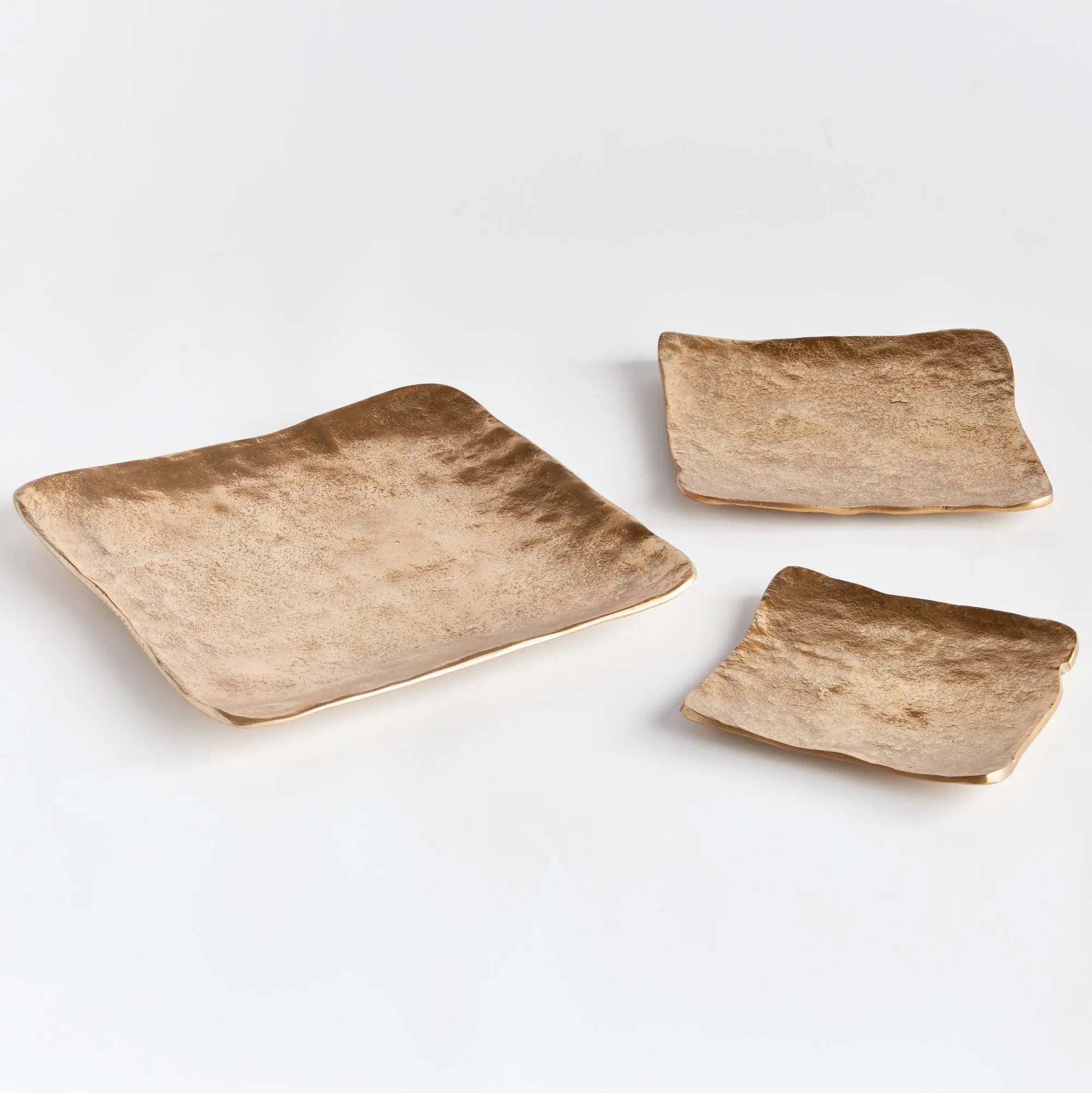 Imani Decorative Trays - modern gold cast aluminum trays with rounded edges, available in rectangular set of 2 or square set of 3