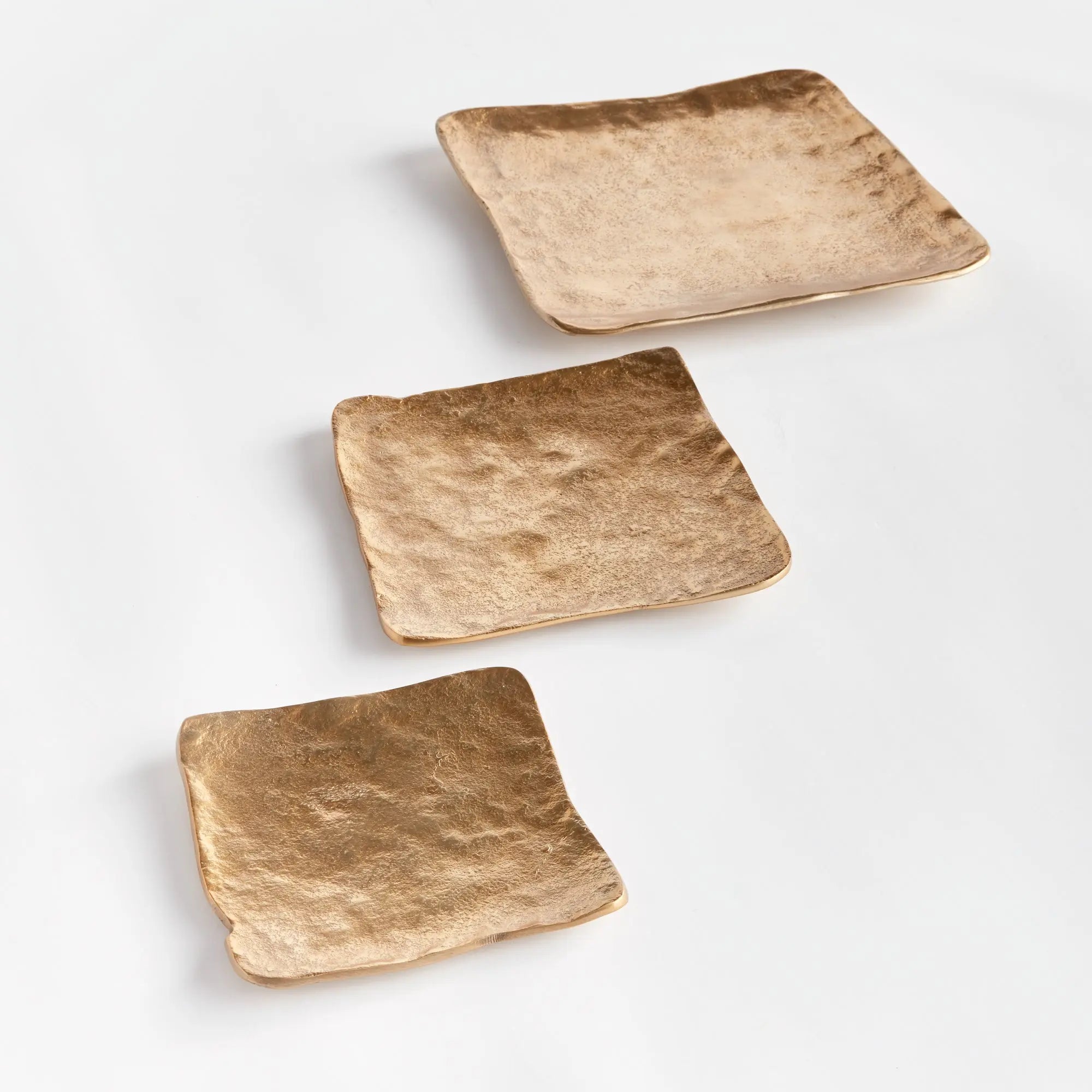 Imani Decorative Trays - modern gold cast aluminum trays with rounded edges, available in rectangular set of 2 or square set of 3