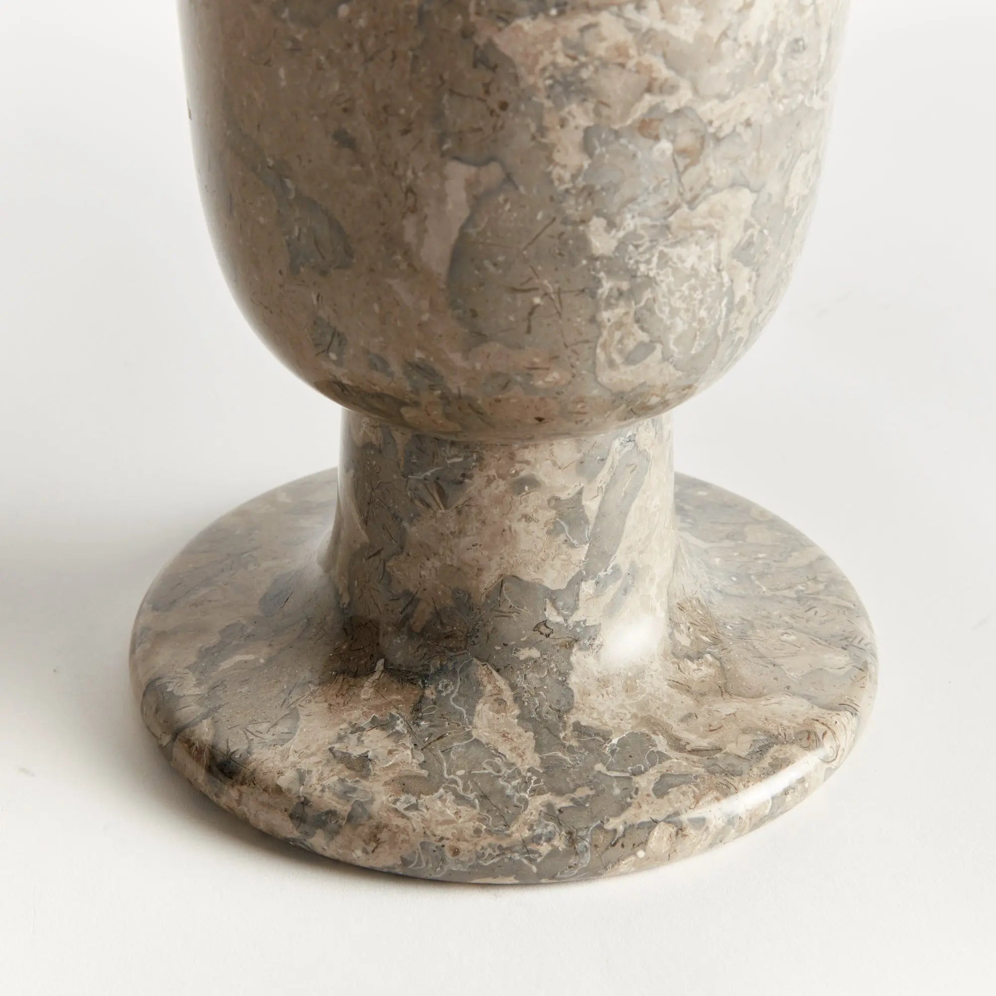 Claria footed vase in natural marble with brown veining