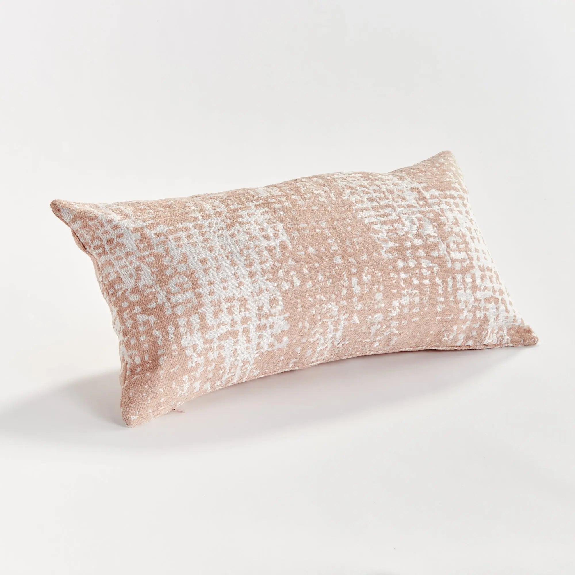 Blush Rectangular pillow with a textured pattern on a white background