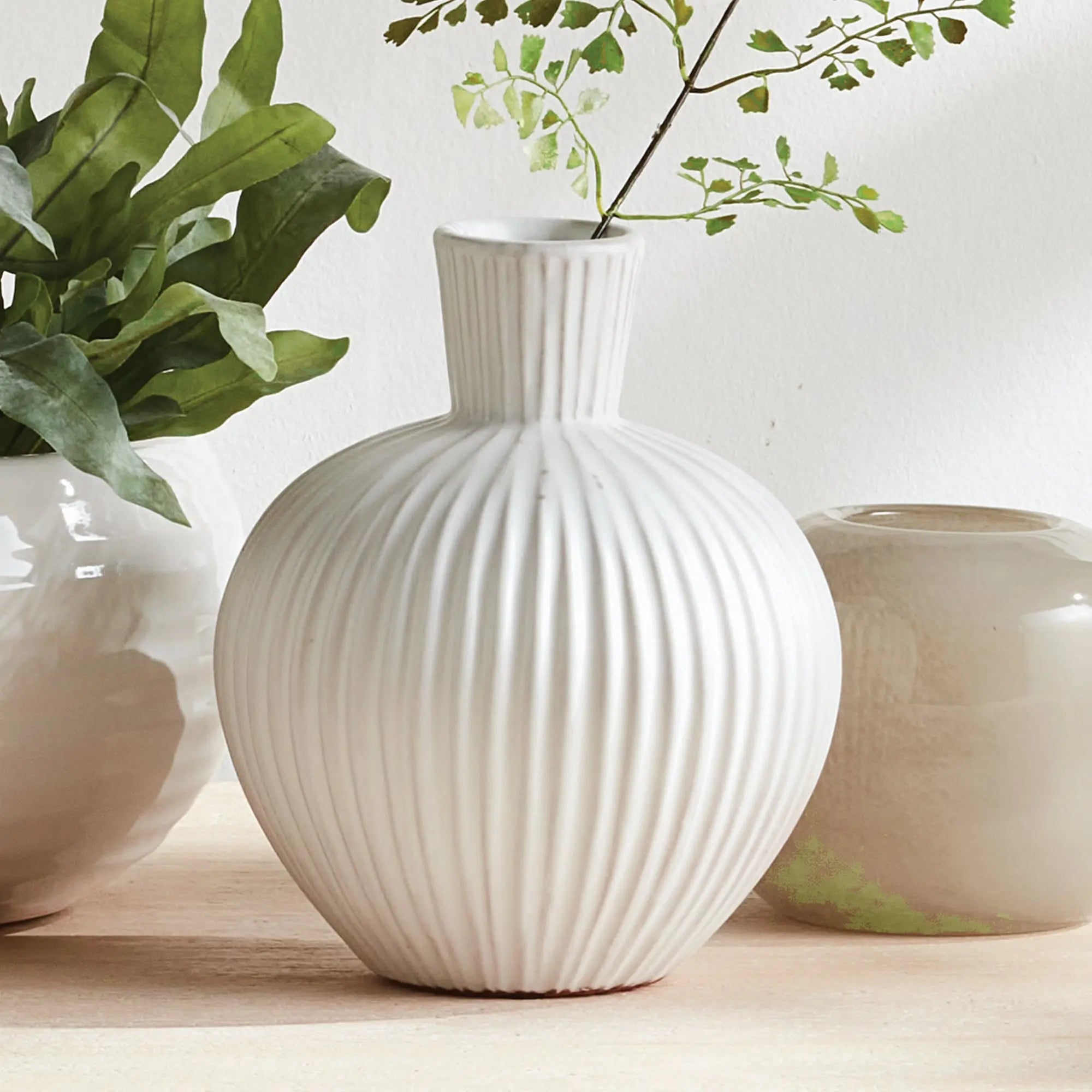 Large white ribbed ceramic Pravi Vase with bottle silhouette