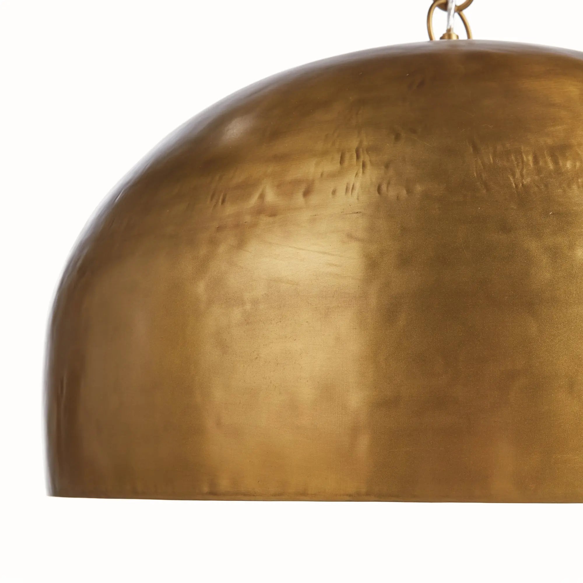 Brass pendant light on a white background