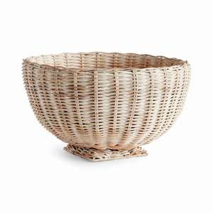 A round woven wicker basket bowl with a flared rim and a small pedestal base, shown on a plain white background.