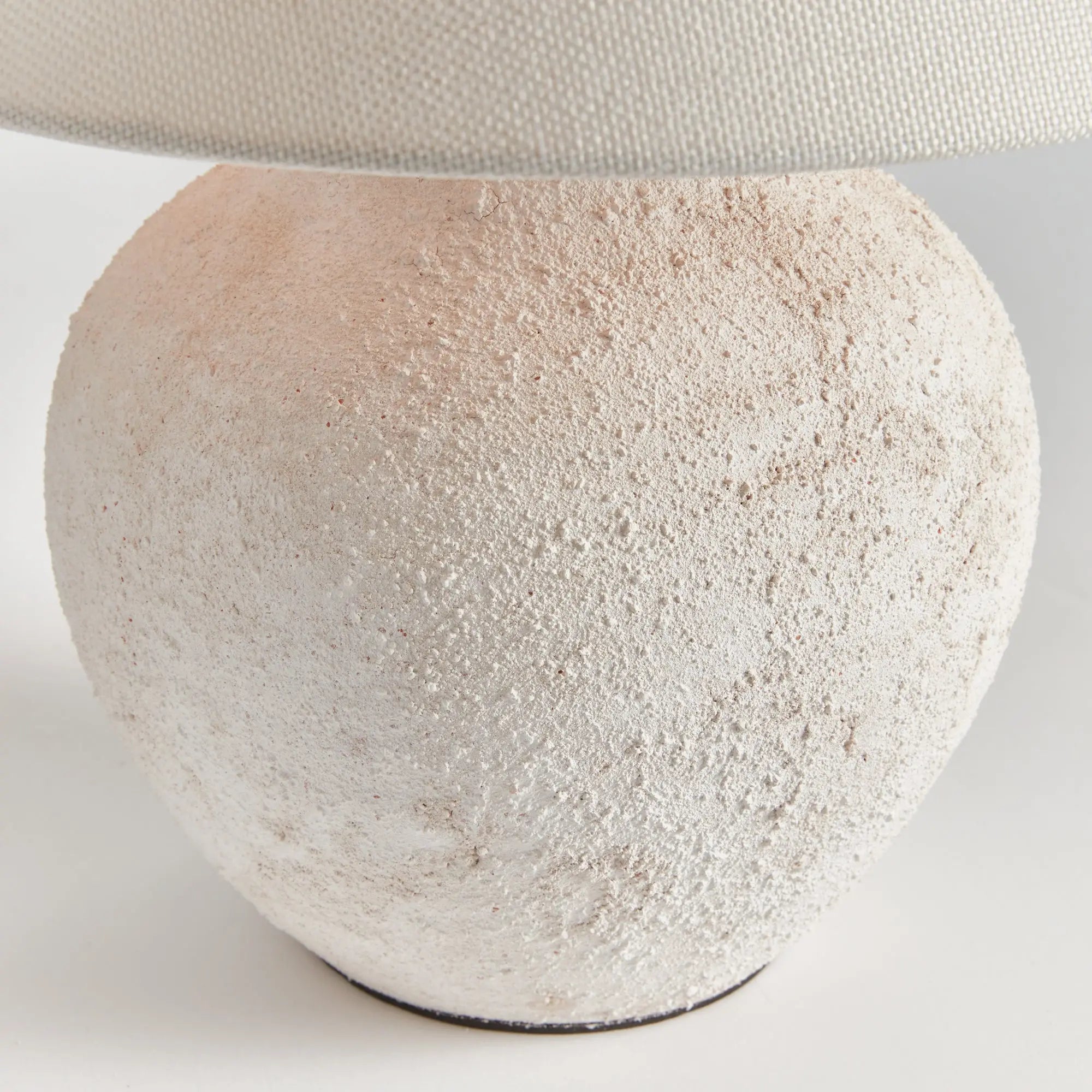 Theo Table Lamp Textured ceramic on a light gray background