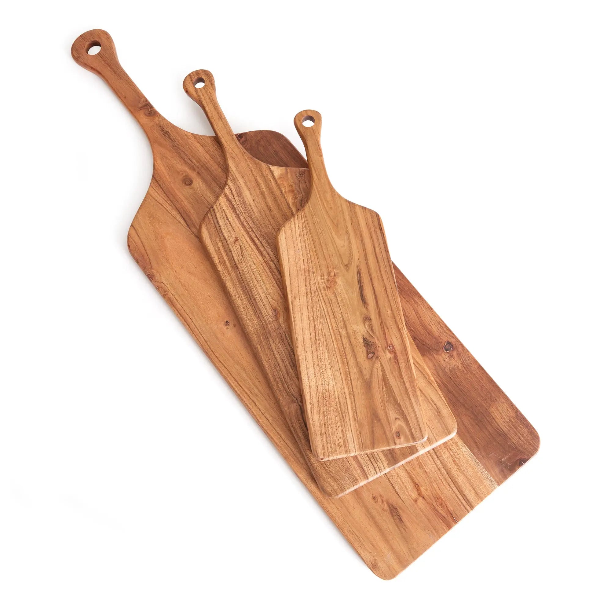 Three wooden cutting boards with handles on a white background