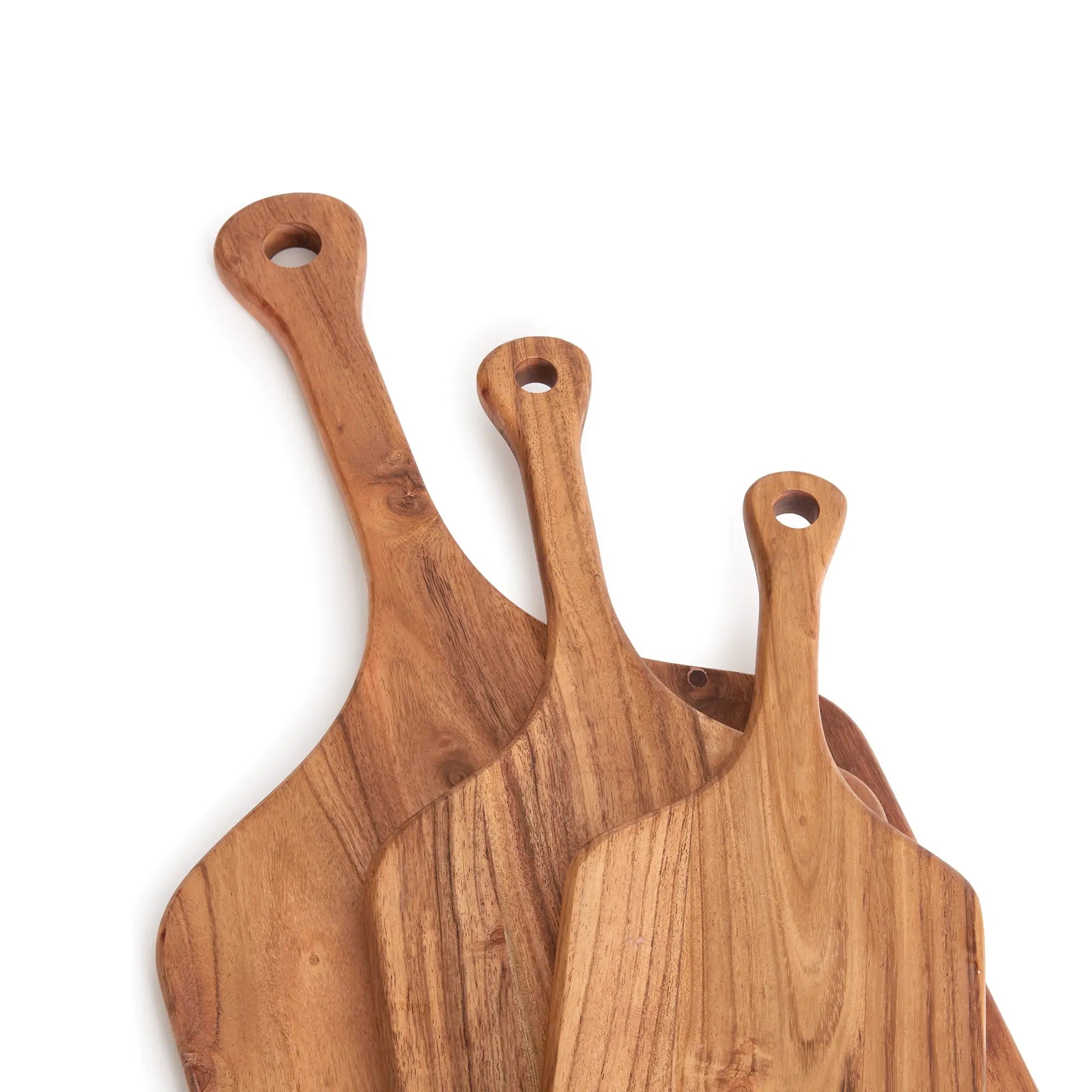 Three wooden pizza peel tools on a white background