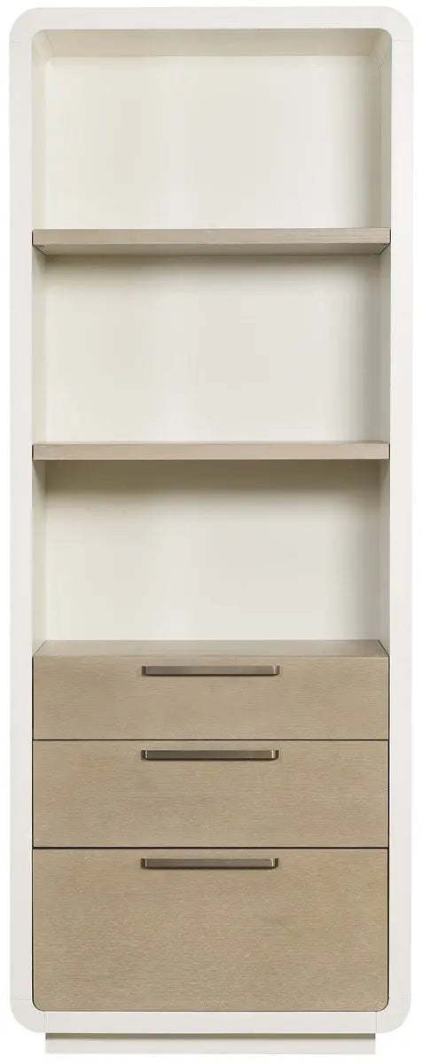 A tall, 84-inch Cove Etagere bookshelf featuring white frost maple sides, cerused taupe oak drawer fronts with long champagne bar handles, and a bottom file drawer.