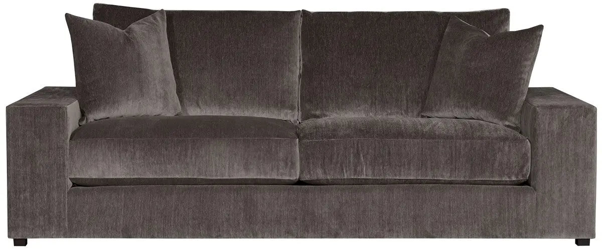 Lucca Two Seat Sofa upholstered in a dark, textured grey velvet fabric, showing its deep seats and plush back cushions.