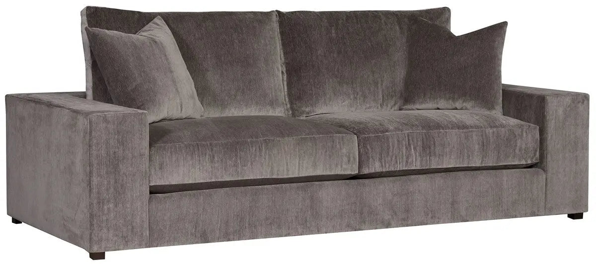 Lucca Two Seat Sofa upholstered in a dark, textured grey velvet fabric, showing its deep seats and plush back cushions.
