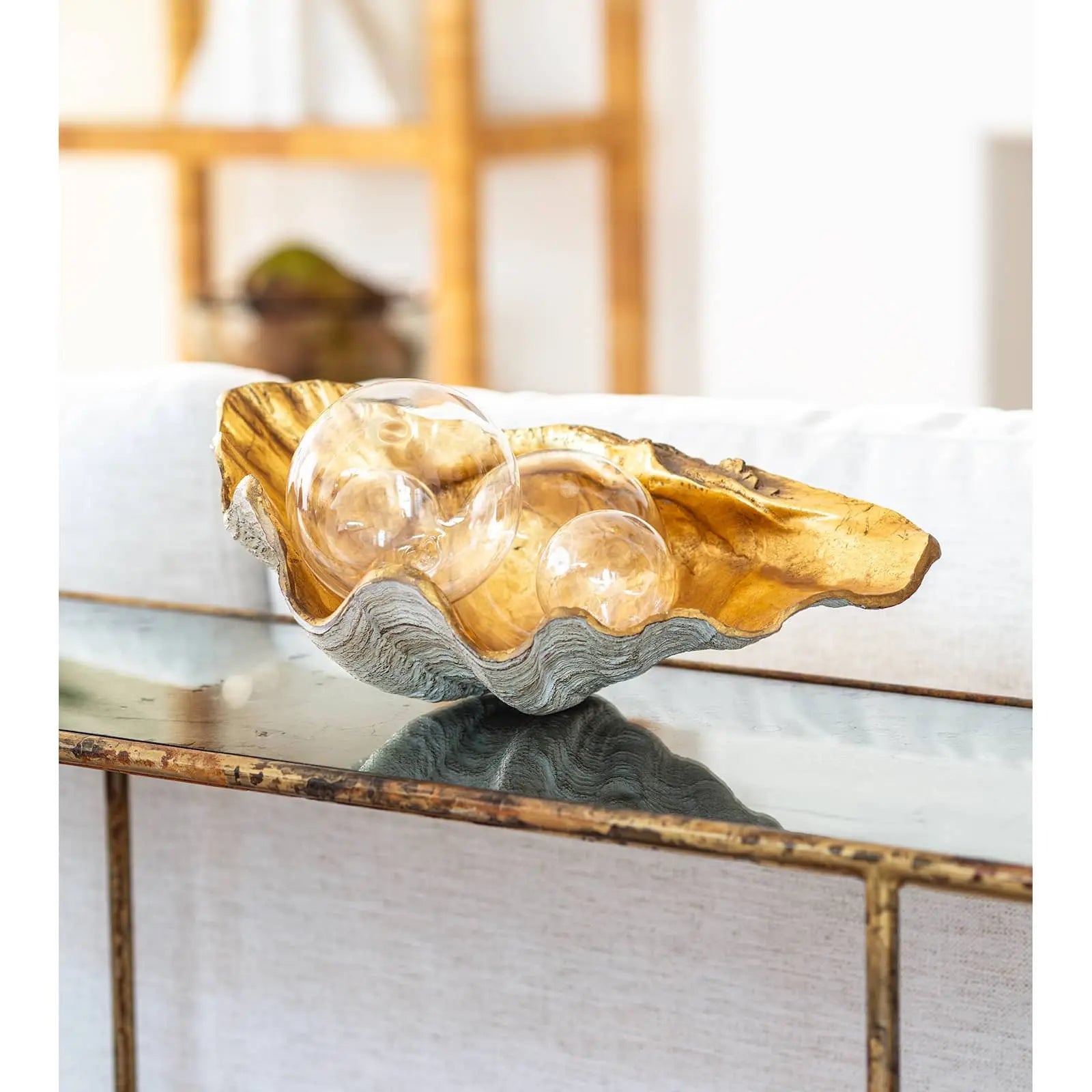 Regina Andrew Golden Clam Bowl, showing the large decorative shell dish with a natural exterior and a shining, hand-finished gold interior.