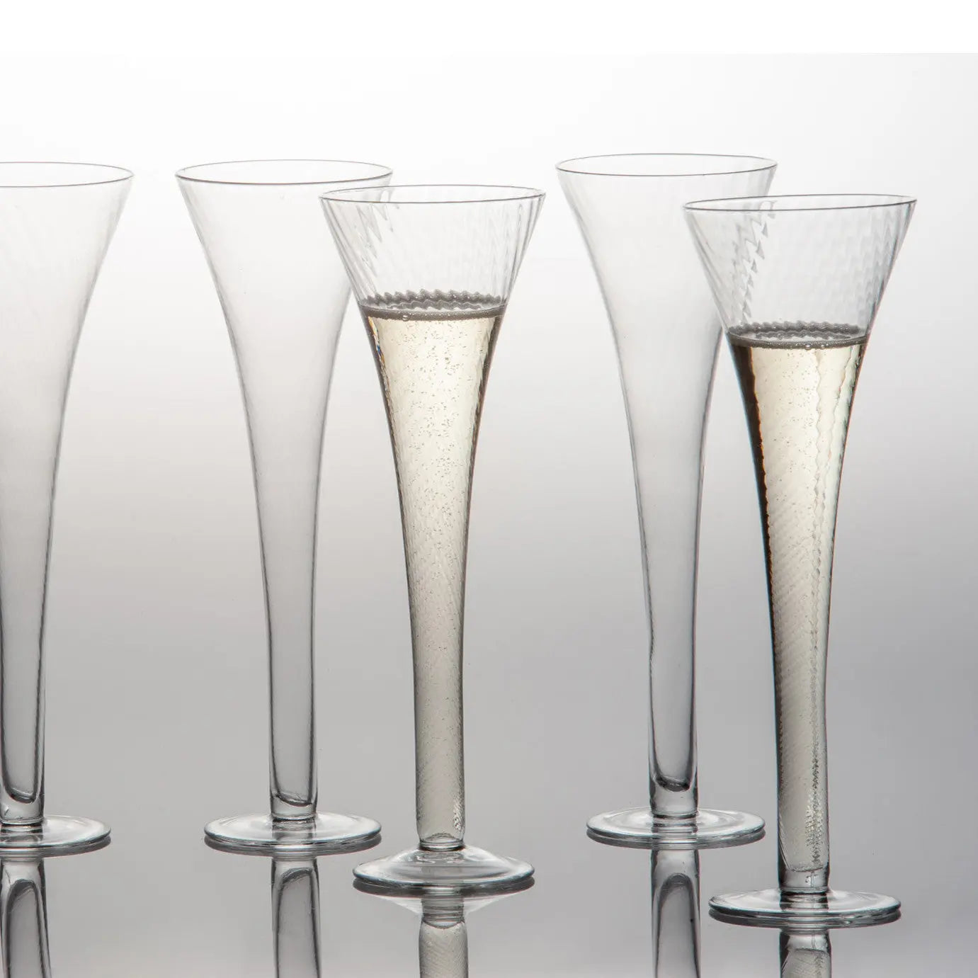 Optic design champagne flute with blown glass pattern - elegant clear glass barware that doubles as decorative flower vase