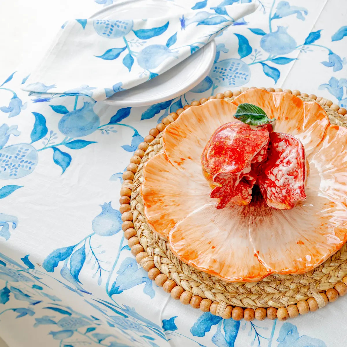 Patterned outdoor Tablecloth protecting a patio dining table