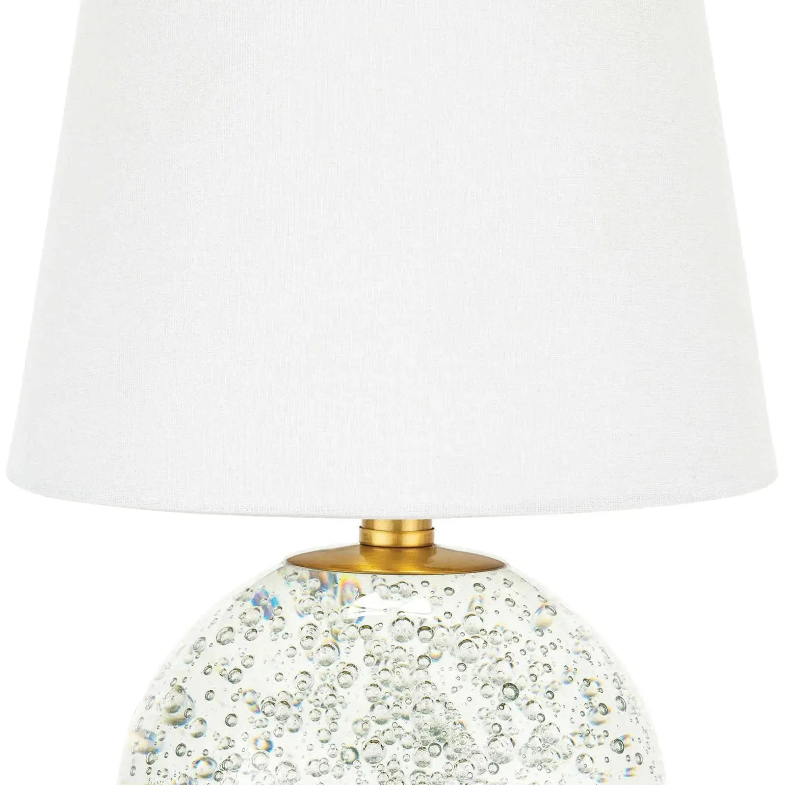 Bulle Crystal Mini Lamp (15" H) with a round clear crystal base containing internal bubbles, gilded neck, and a natural tapered linen shade.