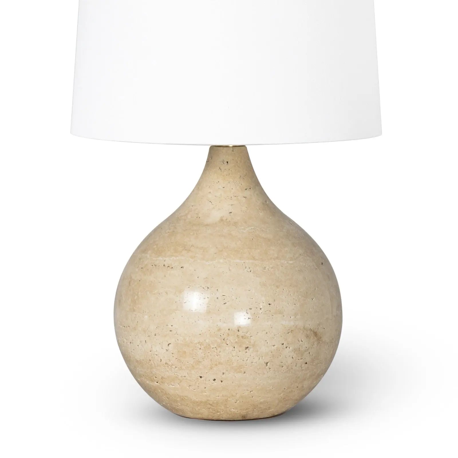 Noa Mini Table Lamp with a smooth, round natural travertine stone base and a simple fabric lamp shade.