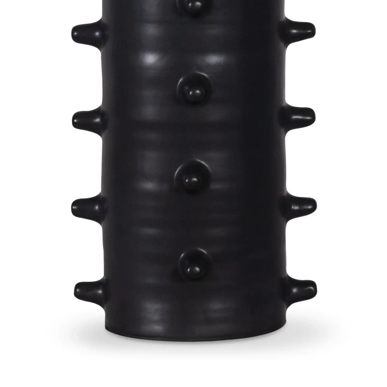 Black textured cylindrical object on a white background
