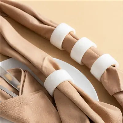 Set of 8 elegant white resin napkin rings in minimalist box for sophisticated dining decor