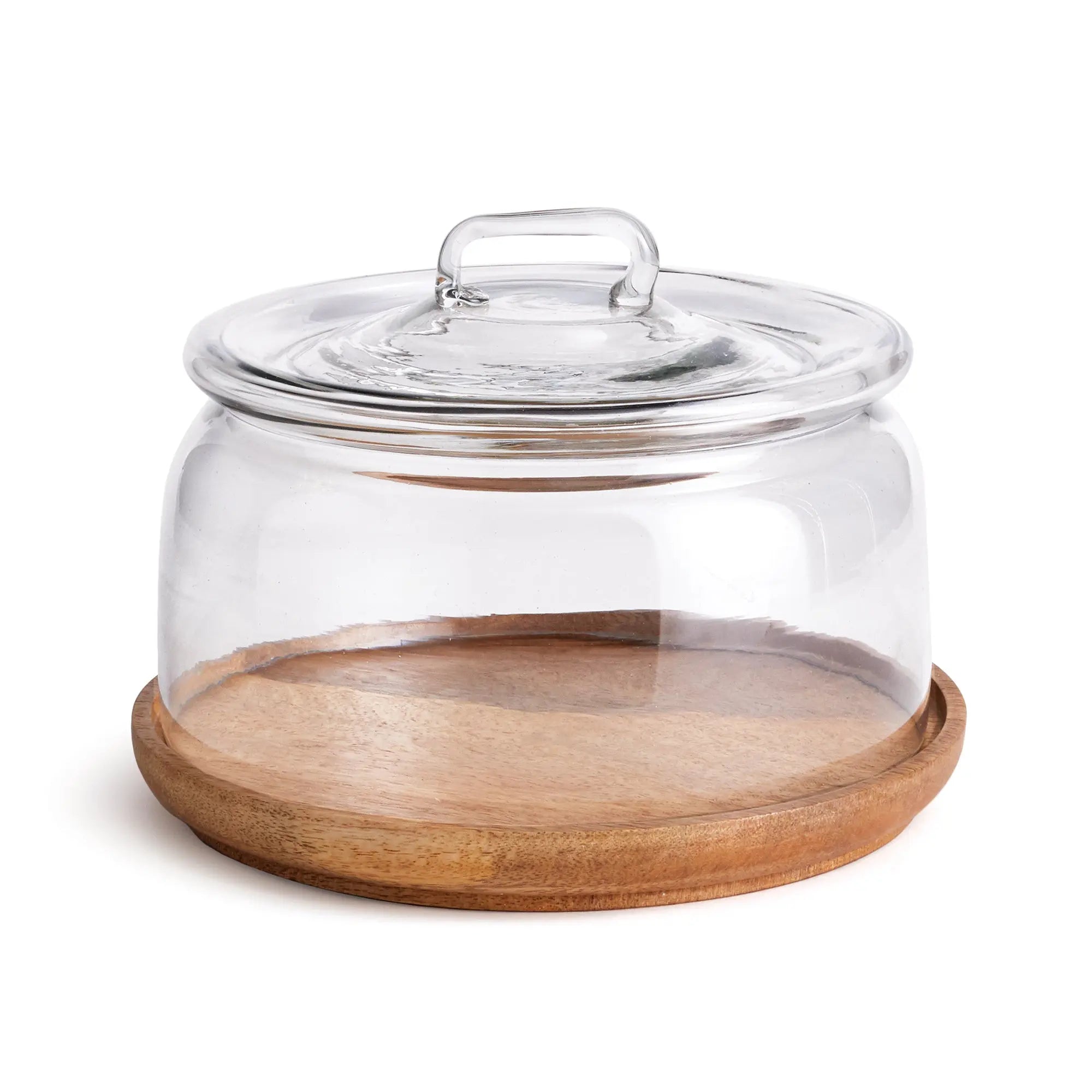 Adrien cloche with a clear glass dome on a round, natural wood tray, styled for serving pastries or cheese.