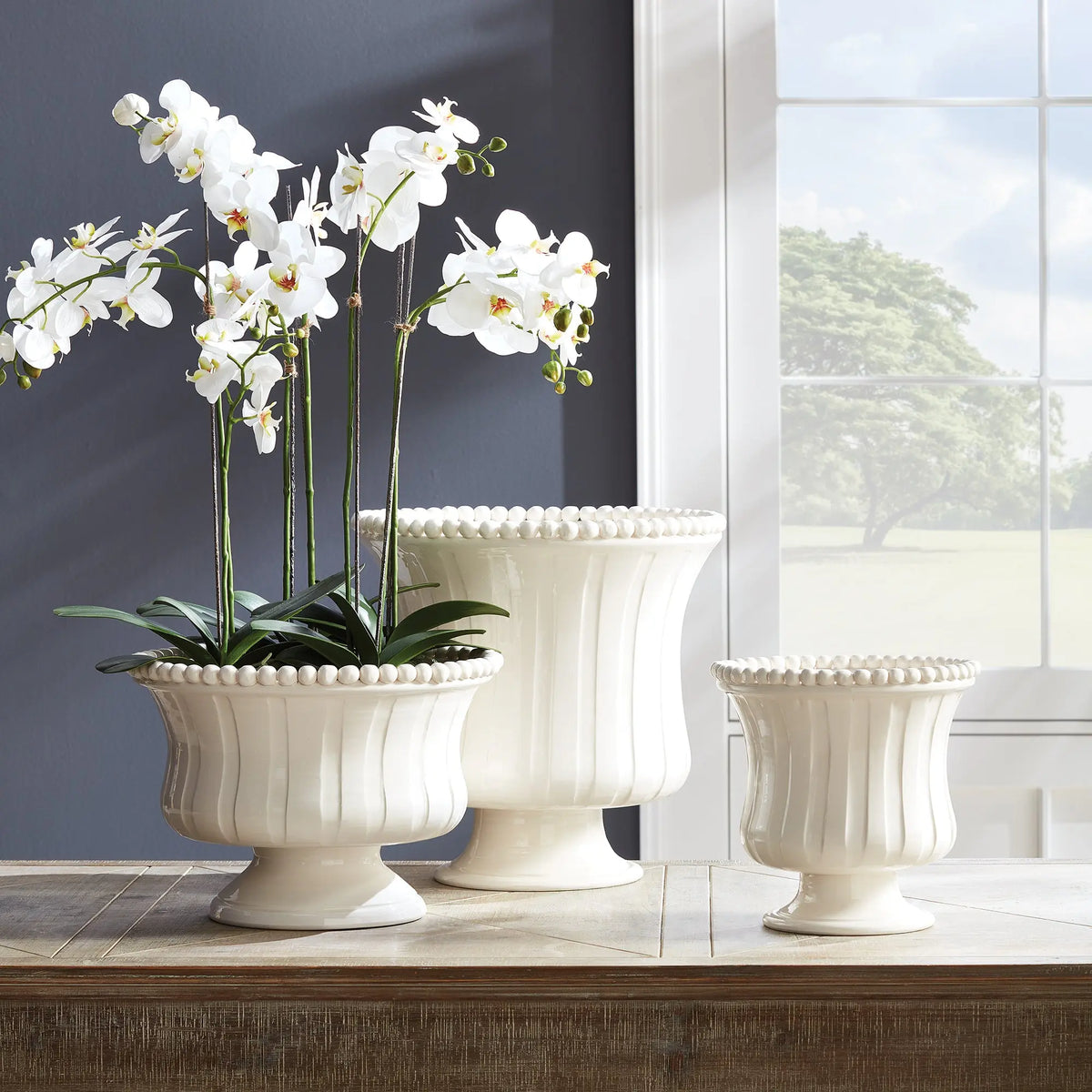 Coletta Petite vase with an orchid, styled beside a taller companion vase