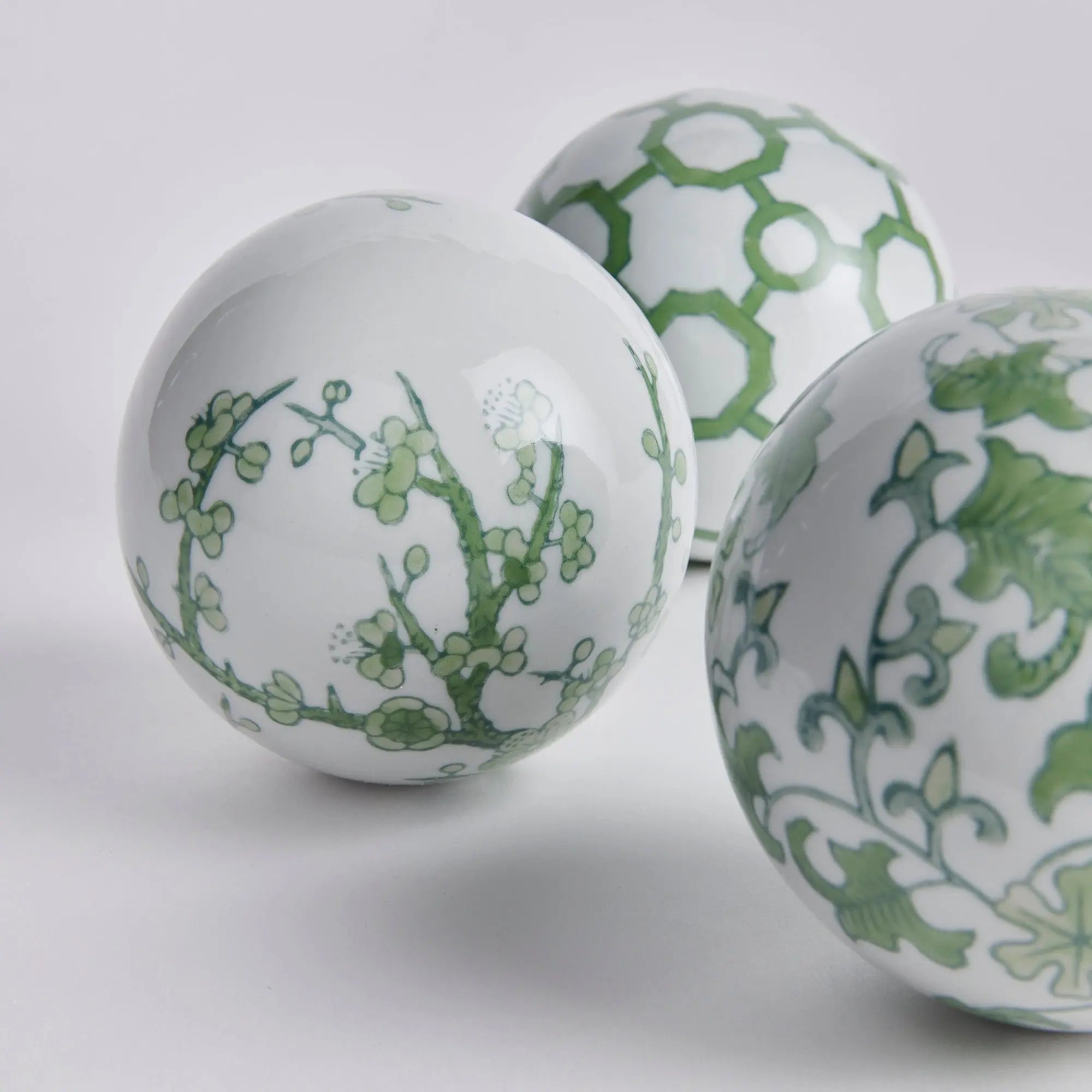 Imperial Orbs Set of 3 - handcrafted green and white chinoiserie ceramic spheres with coordinating patterns for elegant home décor