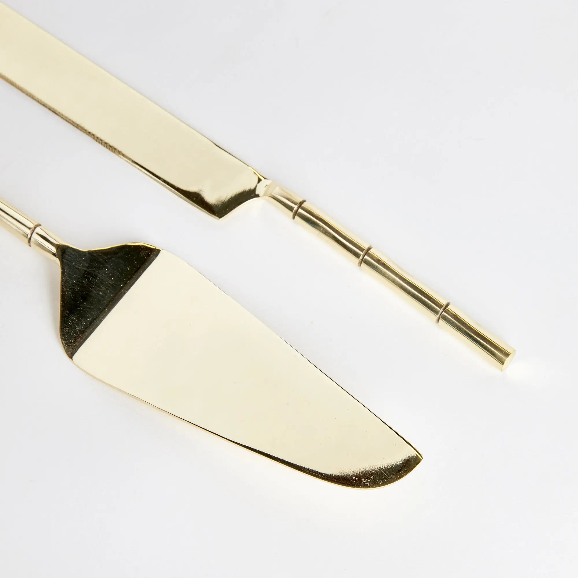 Stainless steel Grove dessert servers inside open retail gift box