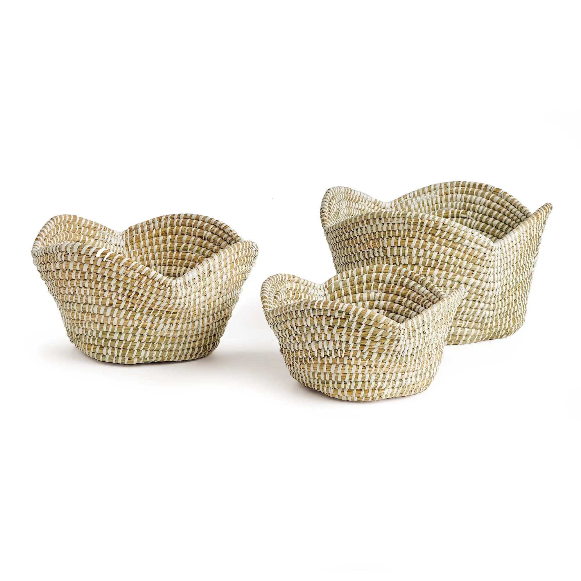 Set of four woven baskets on a white background