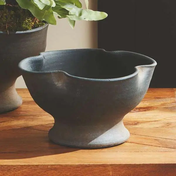 Kaloa Footed Decorative Bowl in a Small size, showing the matte black, hand-rubbed terracotta finish and the unique artisanal shape - Villa Decor & Design