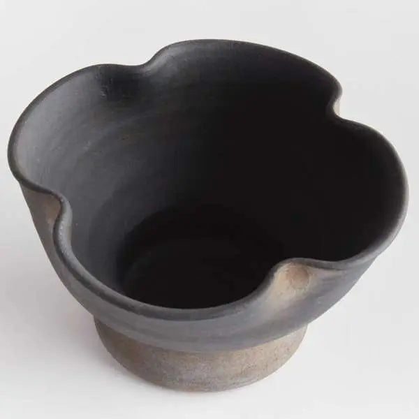 Kaloa Footed Decorative Bowl in a Small size, showing the matte black, hand-rubbed terracotta finish and the unique artisanal shape - Villa Decor & Design