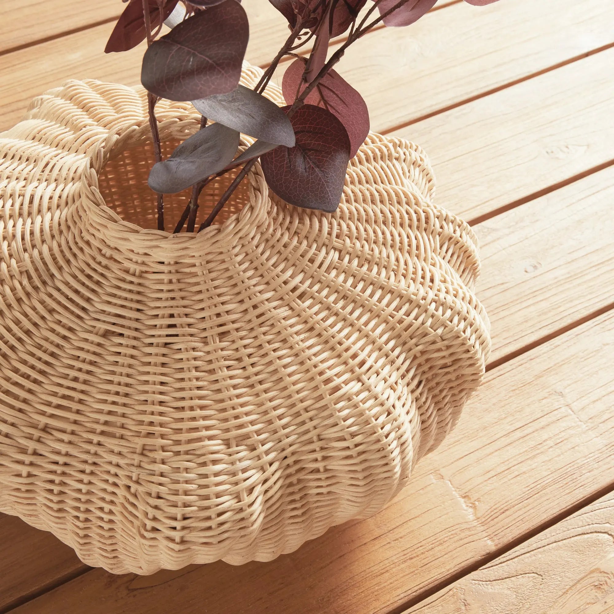 Handwoven short rattan vase with sculptural shape