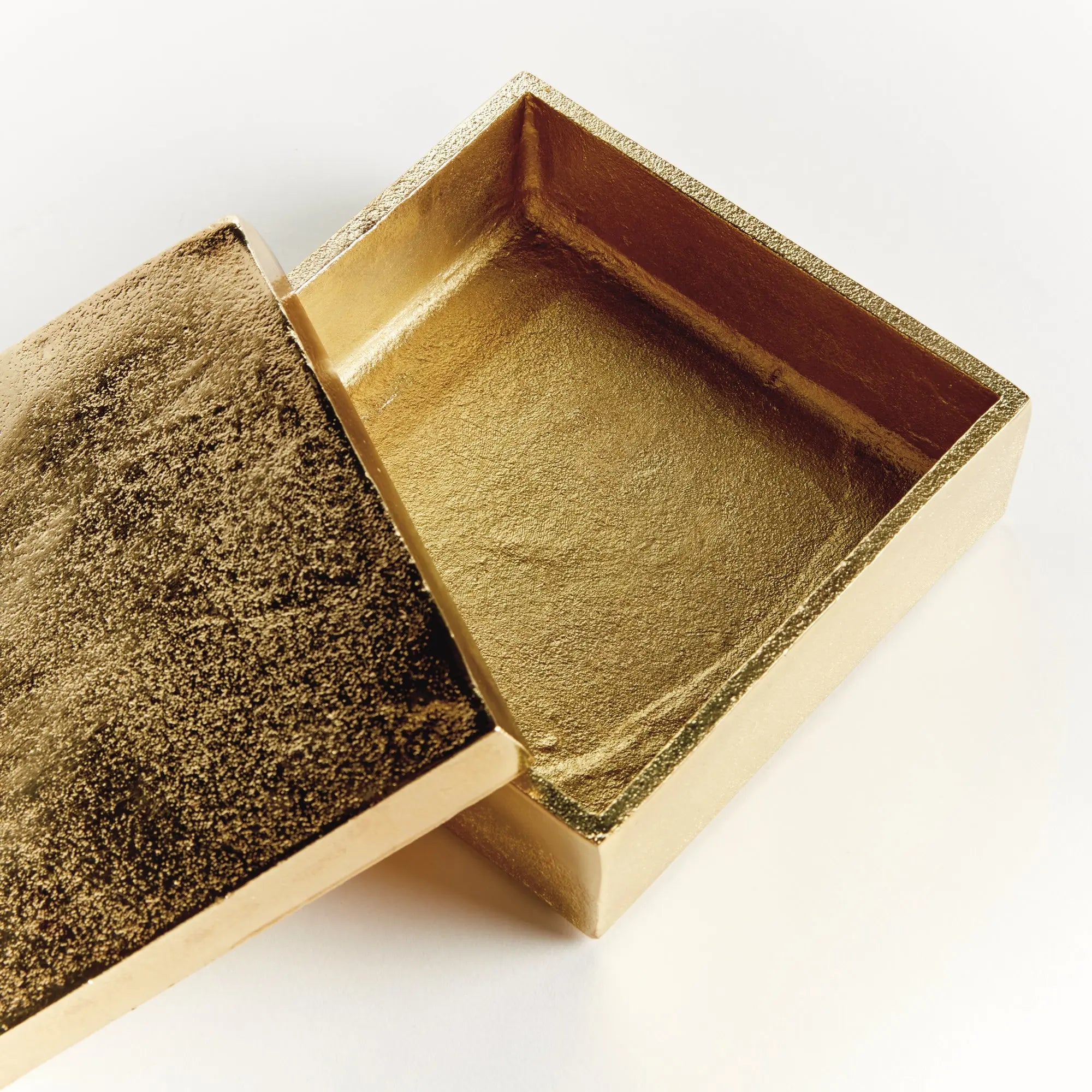 Set of 2 gold Cressida lidded boxes handcrafted from sand-cast aluminum