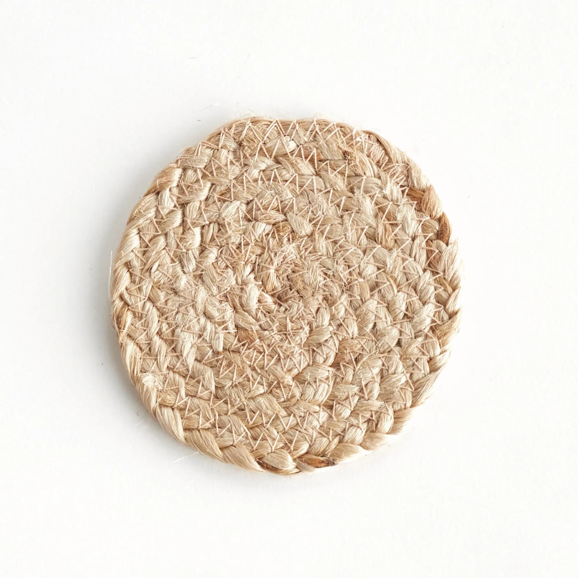 Round woven coaster on a white background