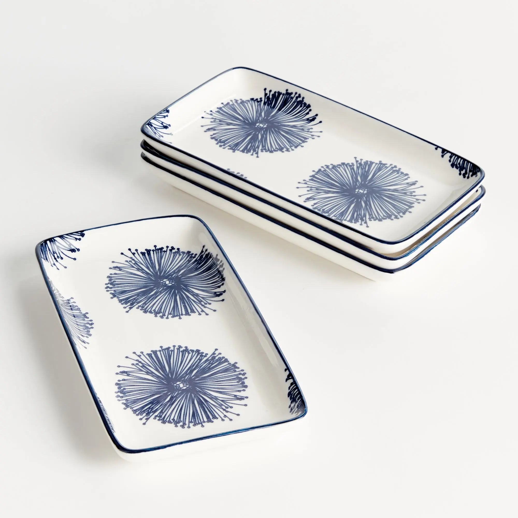 Stria Starburst 8" Trays Set of 4 - dark blue and white ceramic serving trays with starburst radiating pattern for appetizers and entertaining