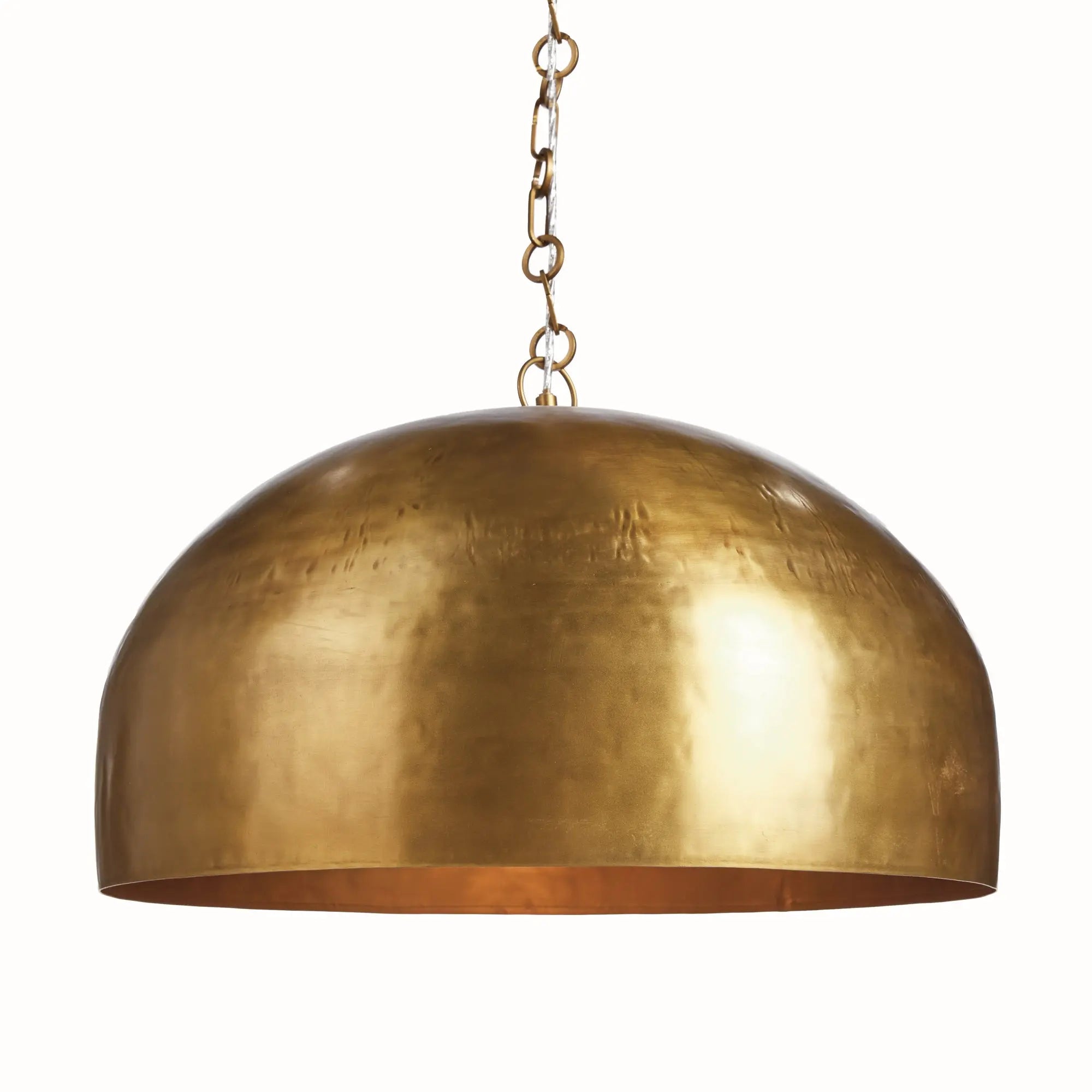 Brass pendant light with chain on a white background