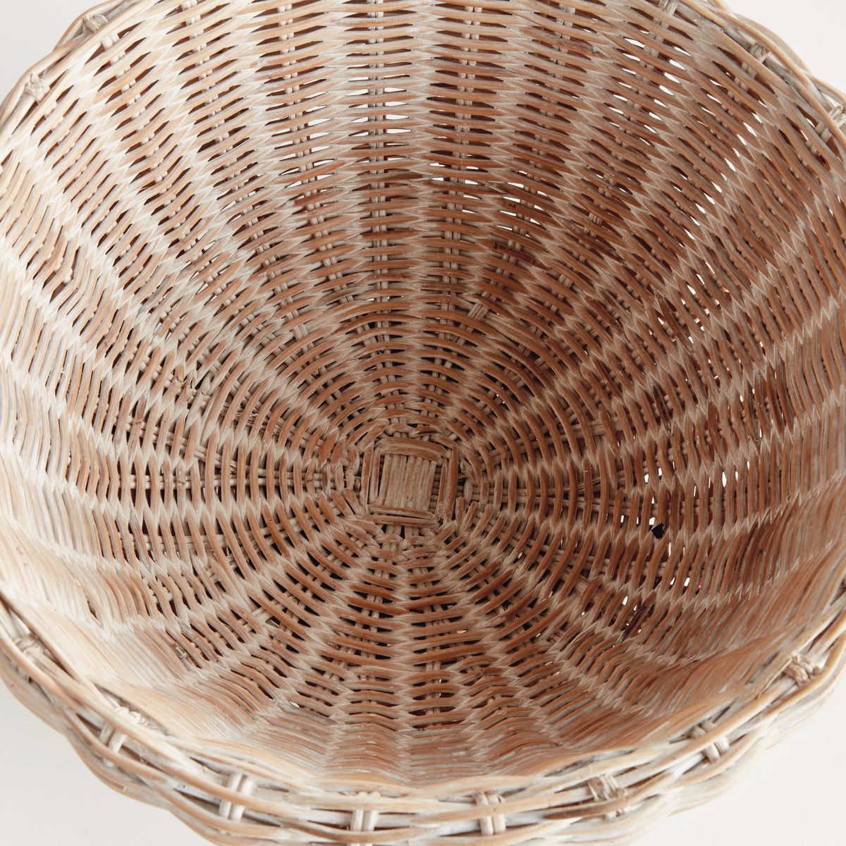 Close-up of a woven basket with a white background