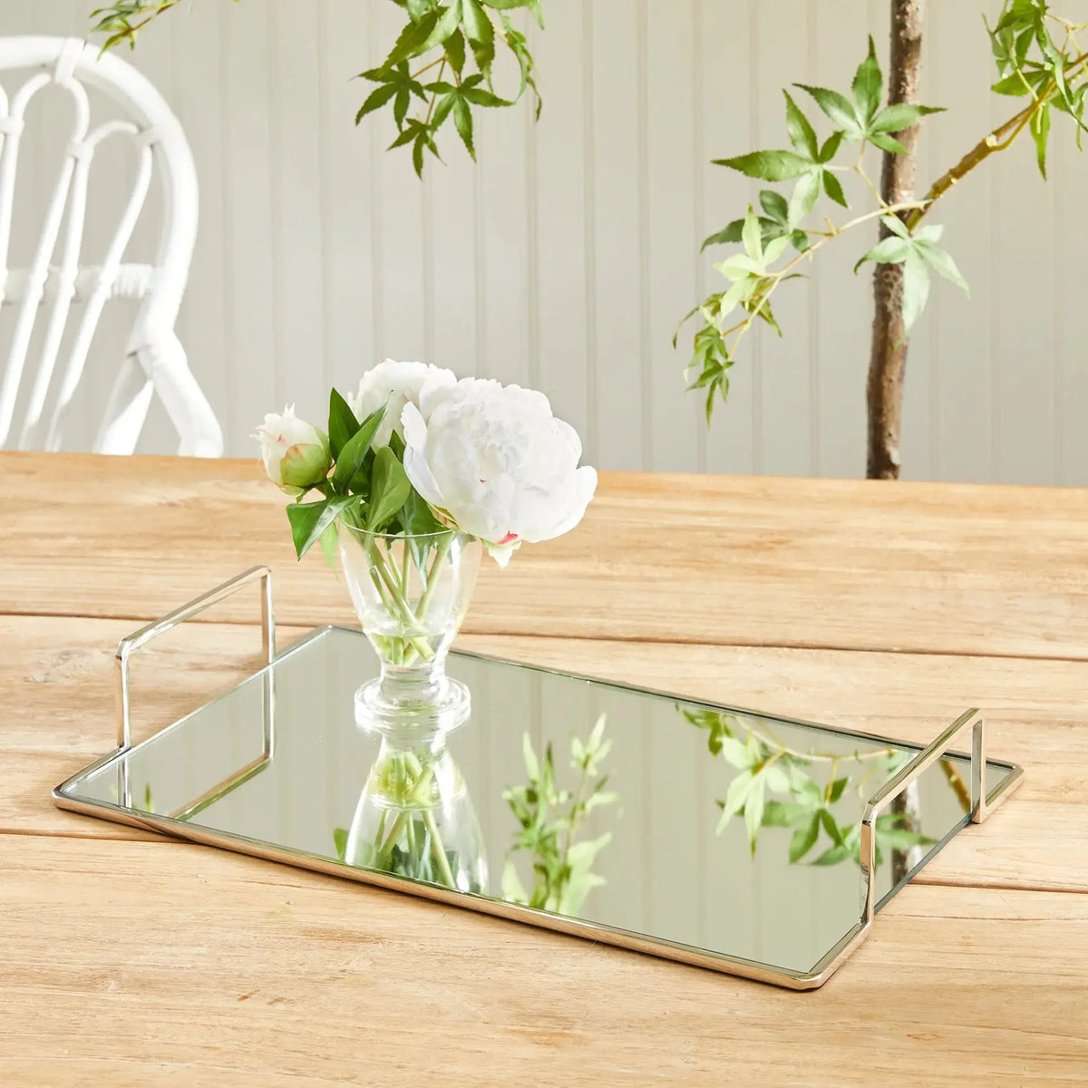 Covina small nickel-tone tray styled with flowers on a wood table