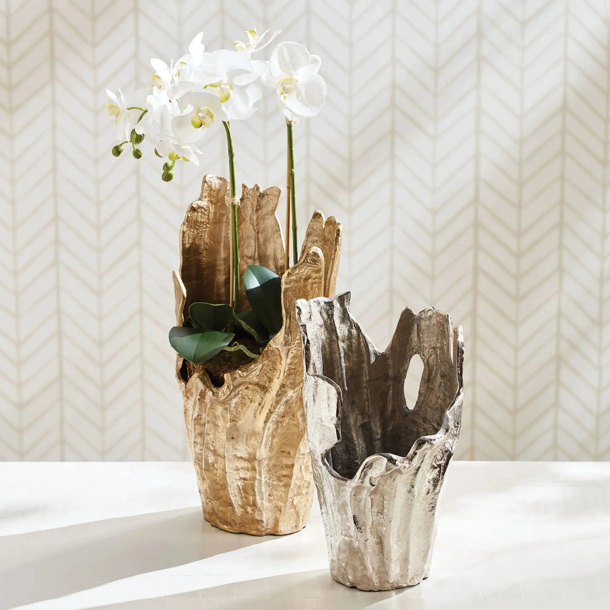 Arbre gold vase styled with orchids on books