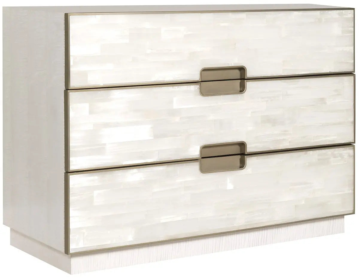 Splendor Selenite Chest, a three-drawer low dresser with drawer fronts faced in natural white selenite, a bleached maple case, and thin soft bronze metal accents.