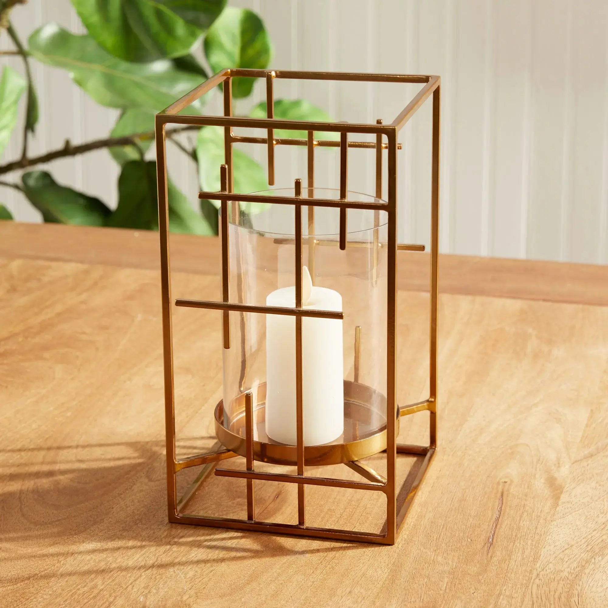 Geometric Gold Hurricane with Mondrian inspired iron lines and clear glass insert on a modern console – Villa Decor & Design