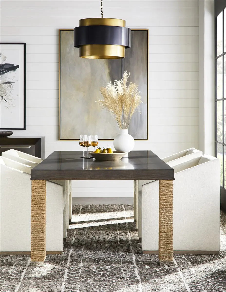 Dunecrest Dining Chair, an upholstered dining chair with arms, covered in light Nomad Snow fabric and featuring a modern Cava wood finish.