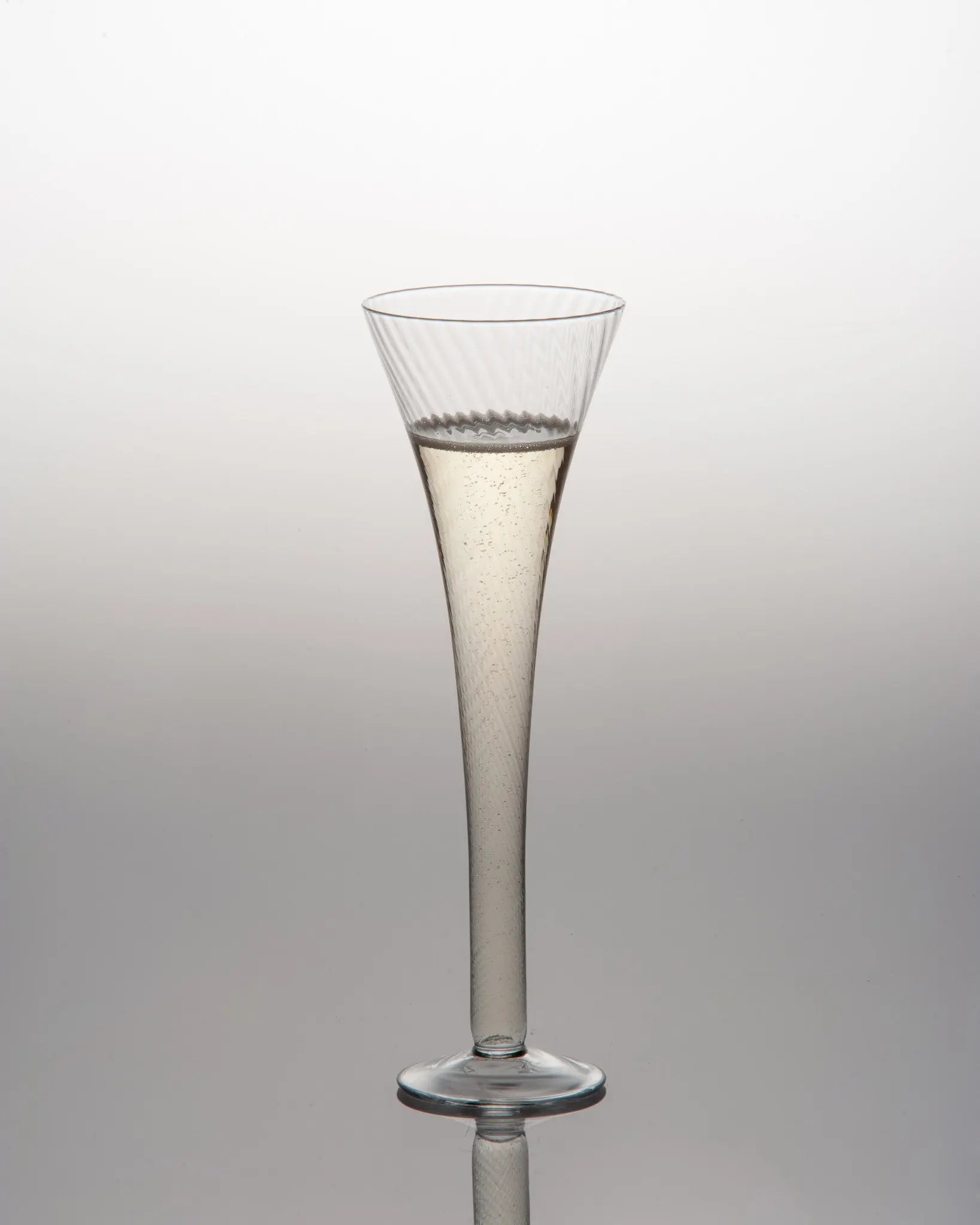 Optic design champagne flute with blown glass pattern - elegant clear glass barware that doubles as decorative flower vase
