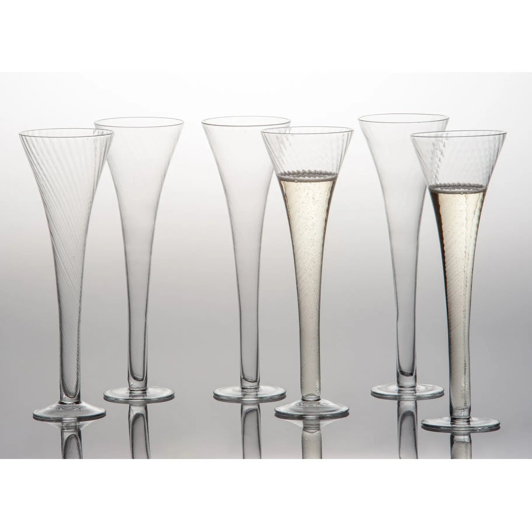 Optic design champagne flute with blown glass pattern - elegant clear glass barware that doubles as decorative flower vase
